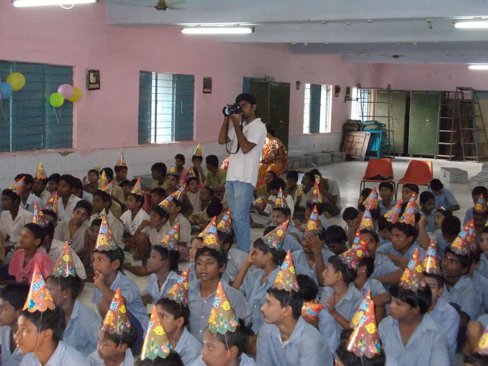 Children wearing party hats during a joyful CHES celebration