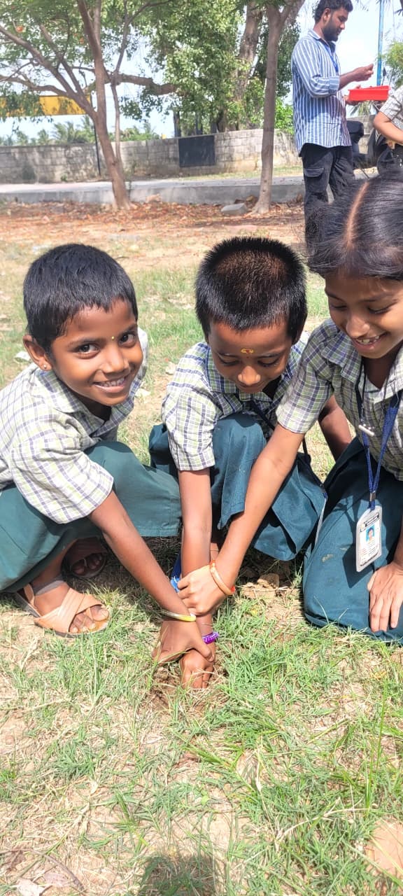 Children learning and participating together outdoors