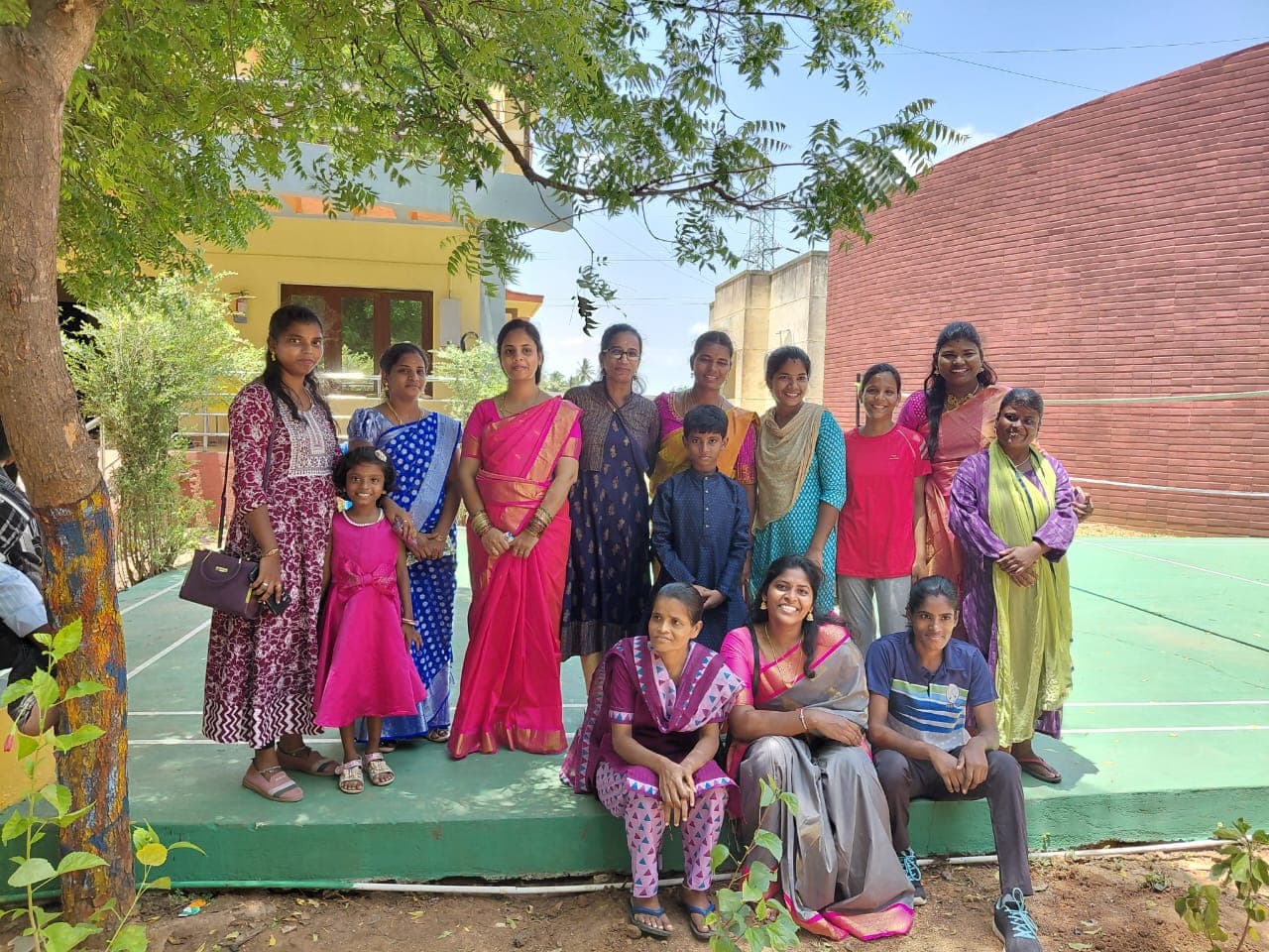 Women and children gathered together in the CHES community