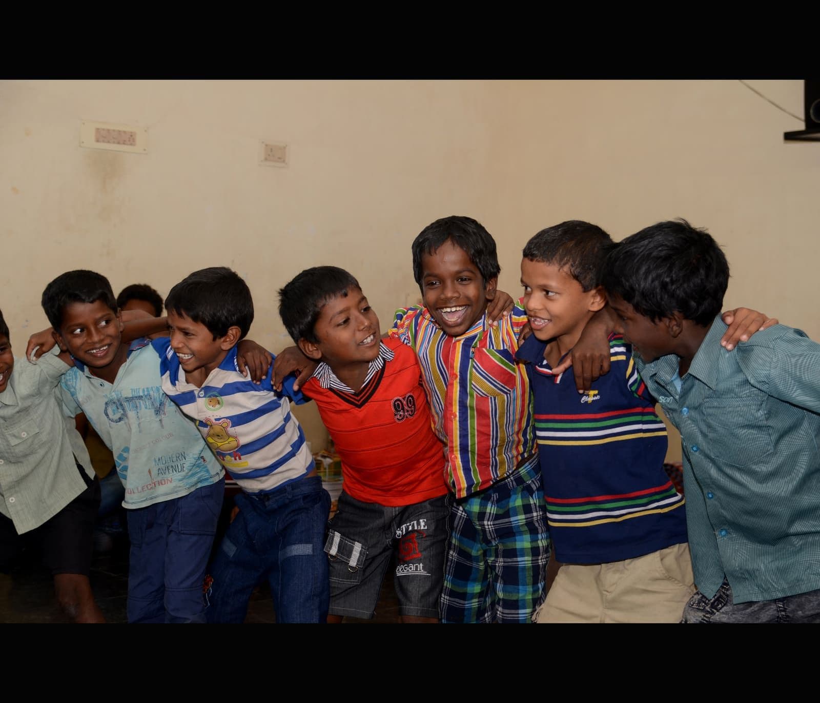 A joyful group of boys laughing together at CHES