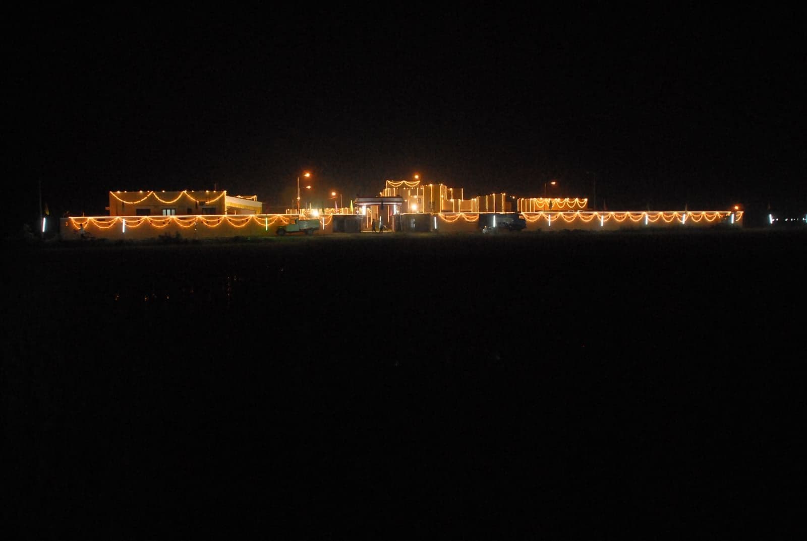 The illuminated CHES care home during an evening event