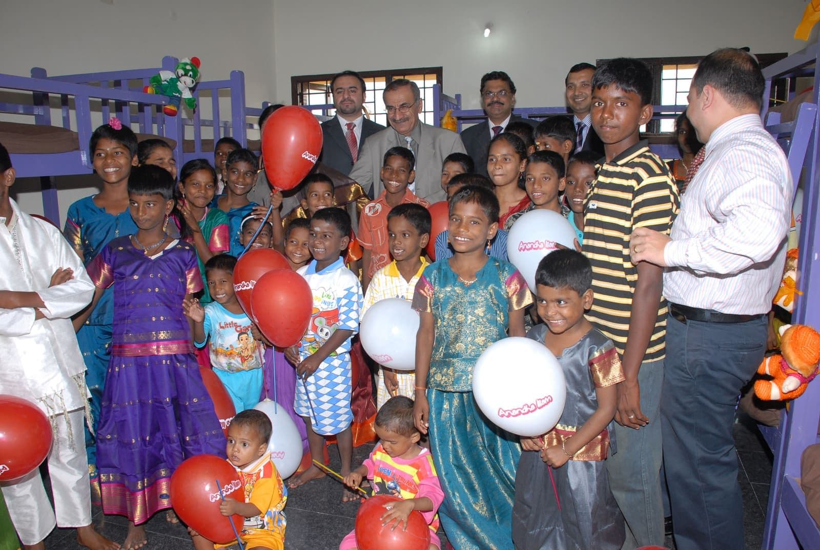 Children, caregivers and guests celebrating together at CHES