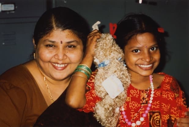 Founder caring for a child in the early years of CHES
