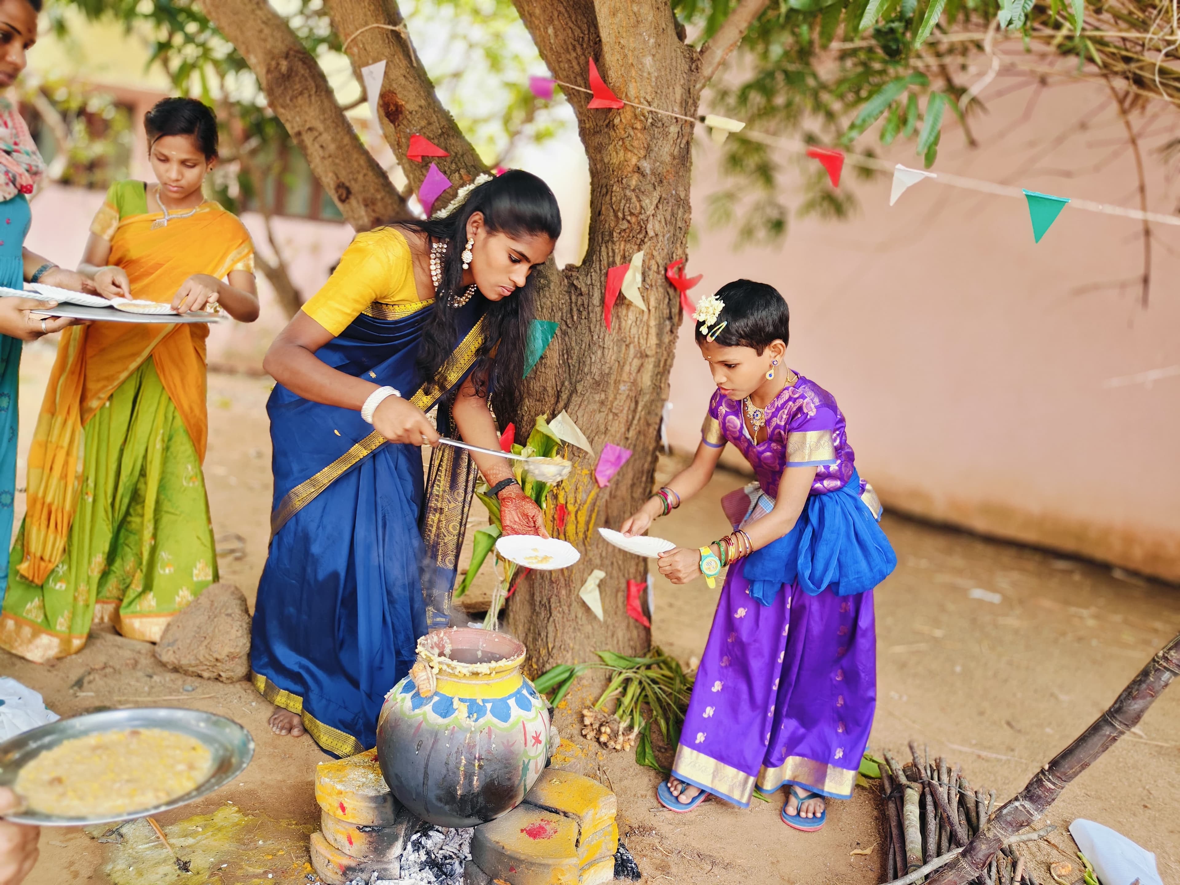 Children and caregivers celebrating together in a bright community space